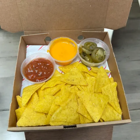 Nachos with warm cheese sauce, salsa & jalapeños 